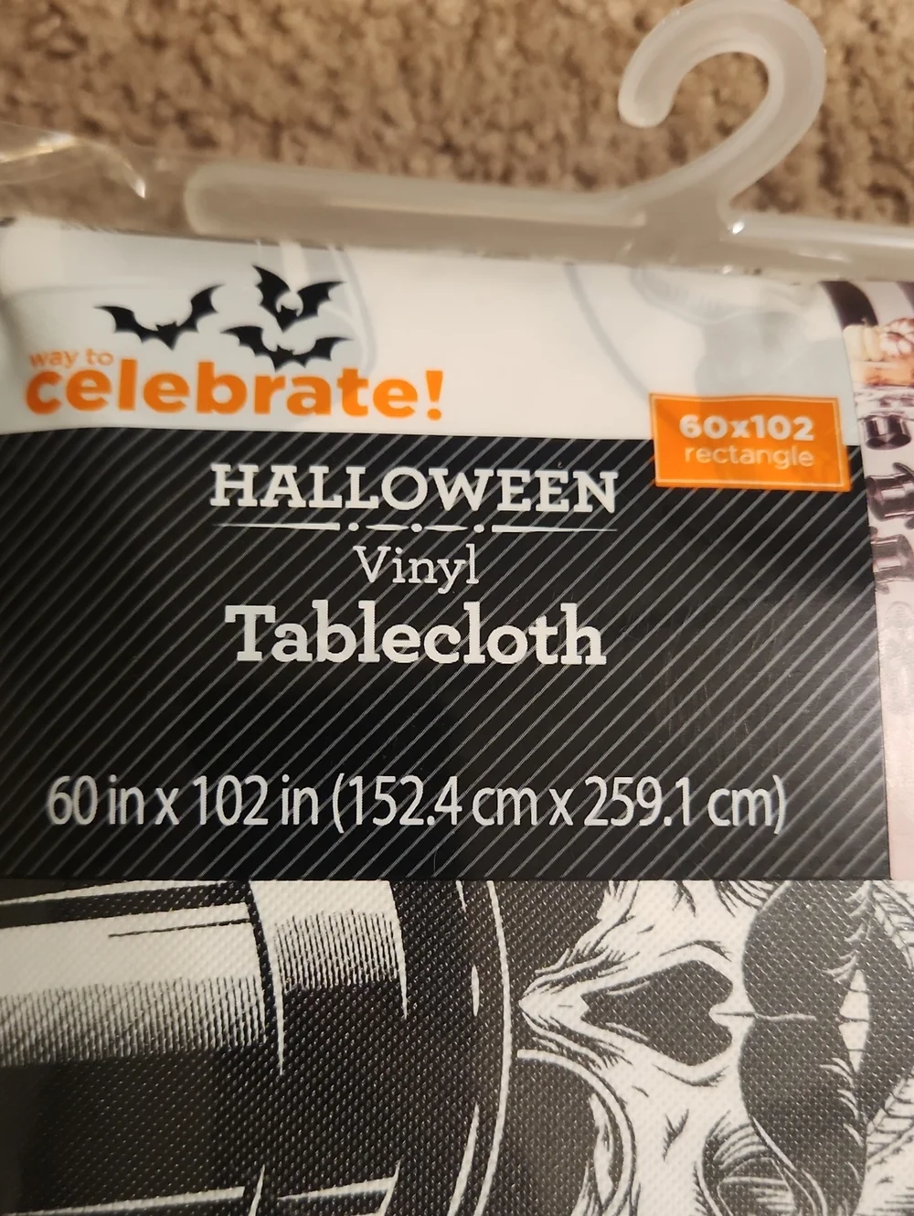 Brand new Halloween Vinyl Tablecloth. White with Black Skull & Top Hat Pattern